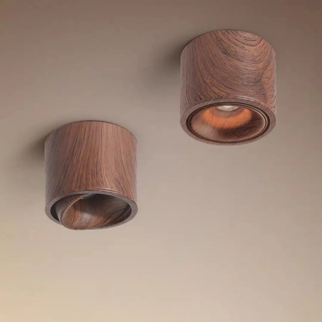 Dois plafons de teto em acabamento madeireiro instalados em parede cinza — Luminária Plafon LED ultrafino rotativo Nivor — Tonzi